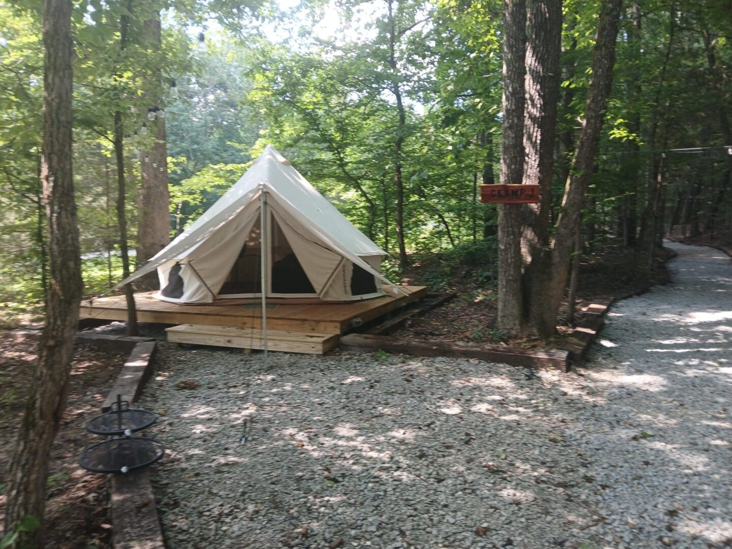 Tent in a forest campsite setting.