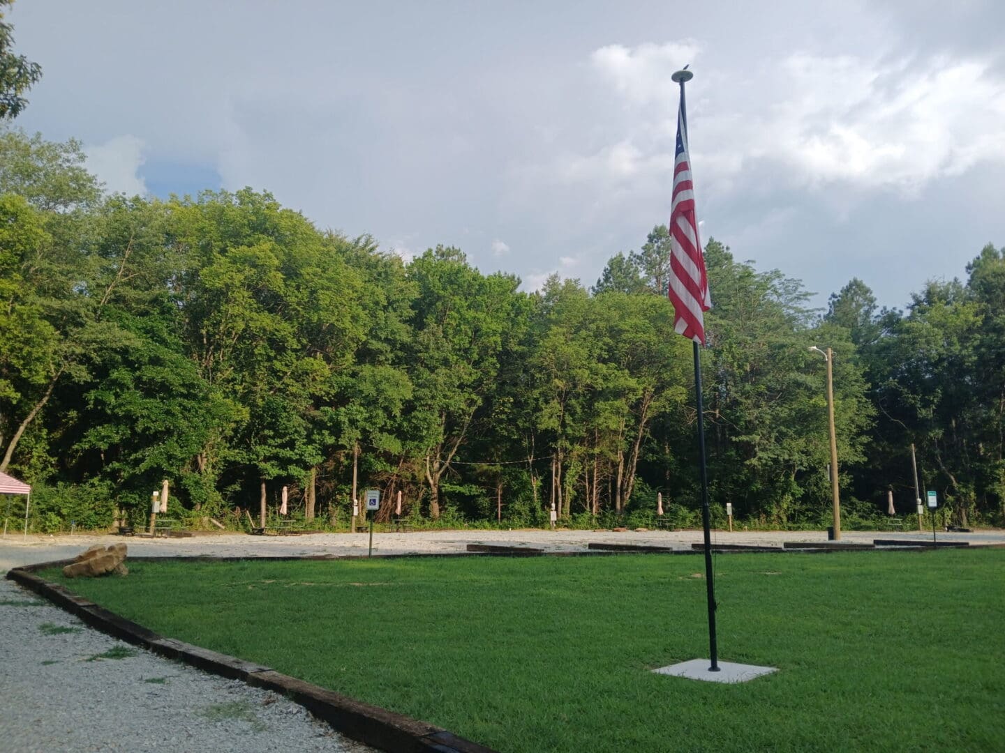 American flag on pole in grassy field