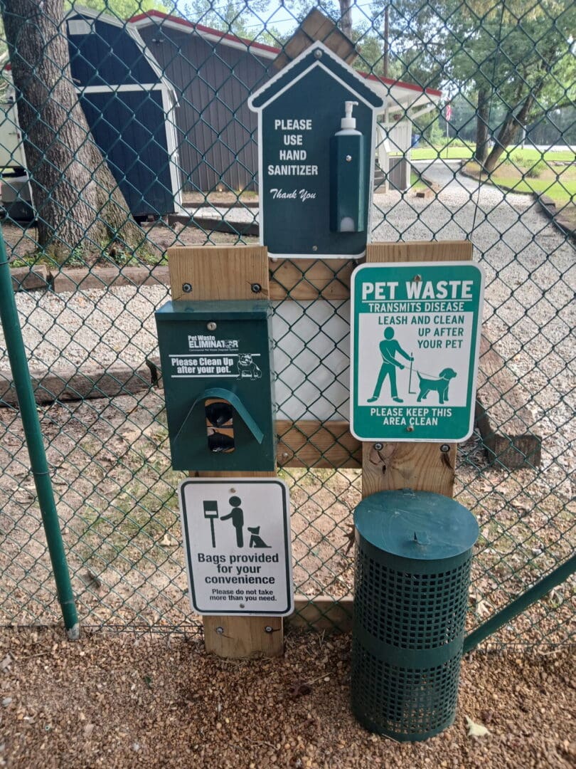Pet waste station with sanitizer and bags