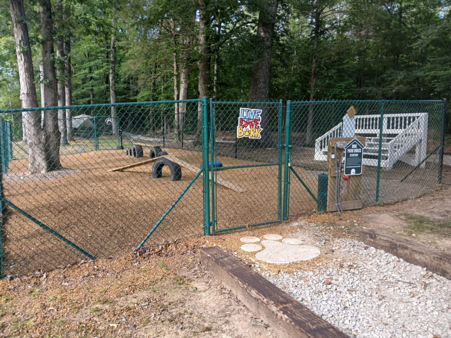 Fenced dog park with agility equipment