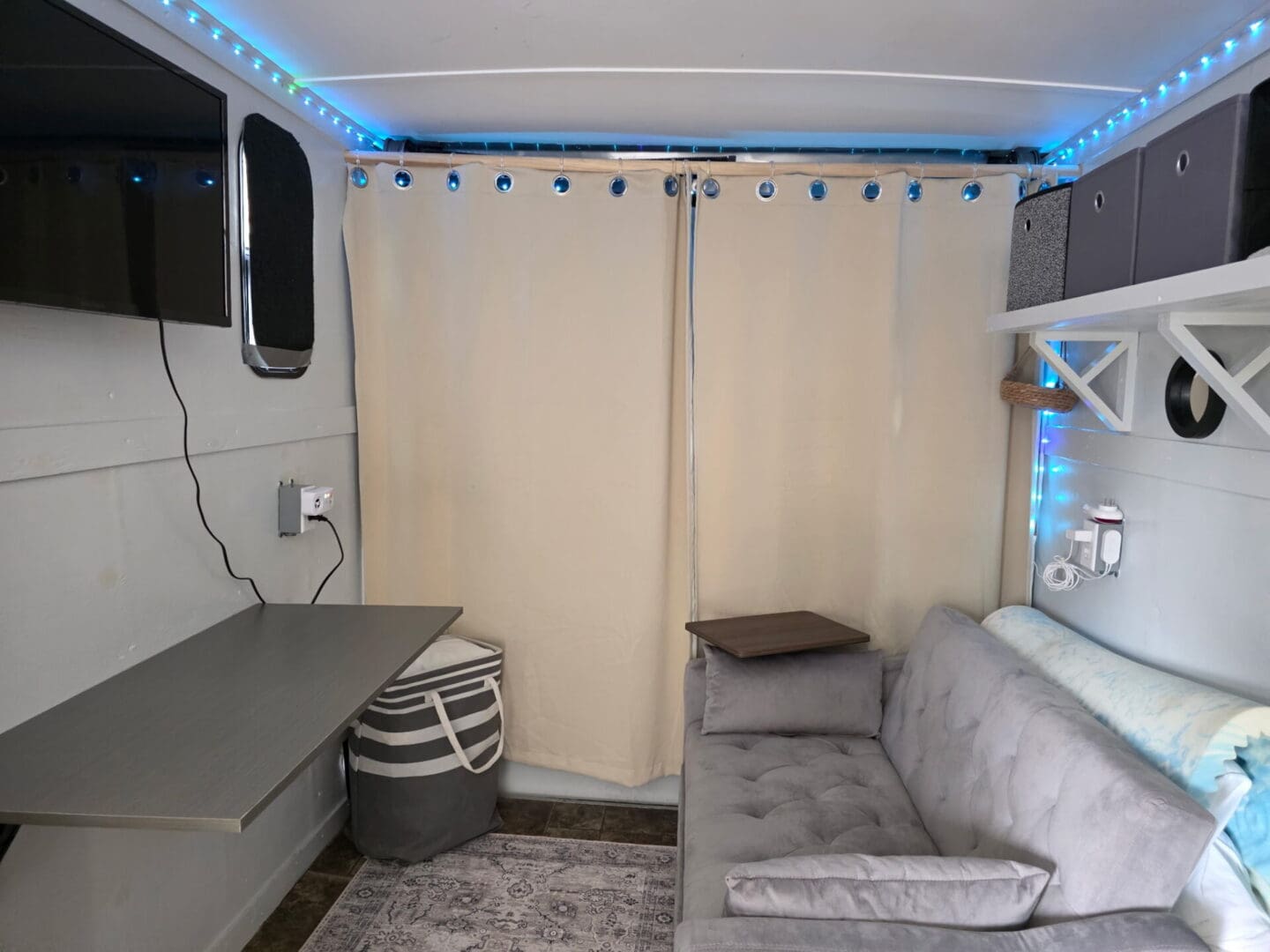 Cozy camper interior with couch and curtains