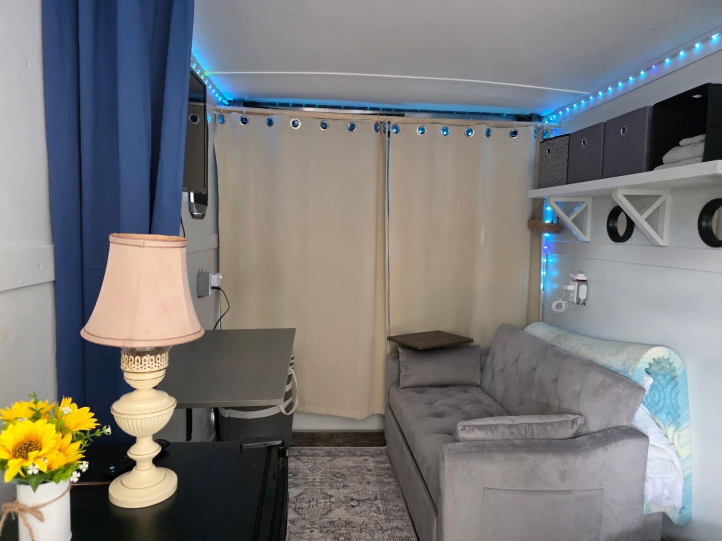 Cozy living area with gray sofa and lamp