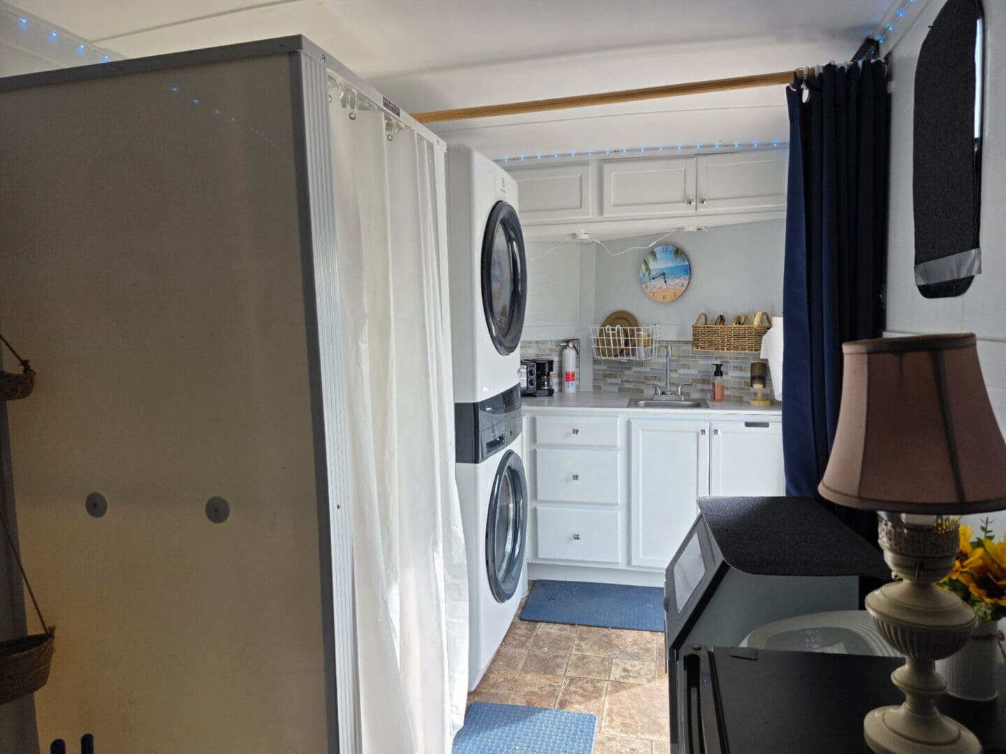 Stacked washer and dryer in compact kitchenette