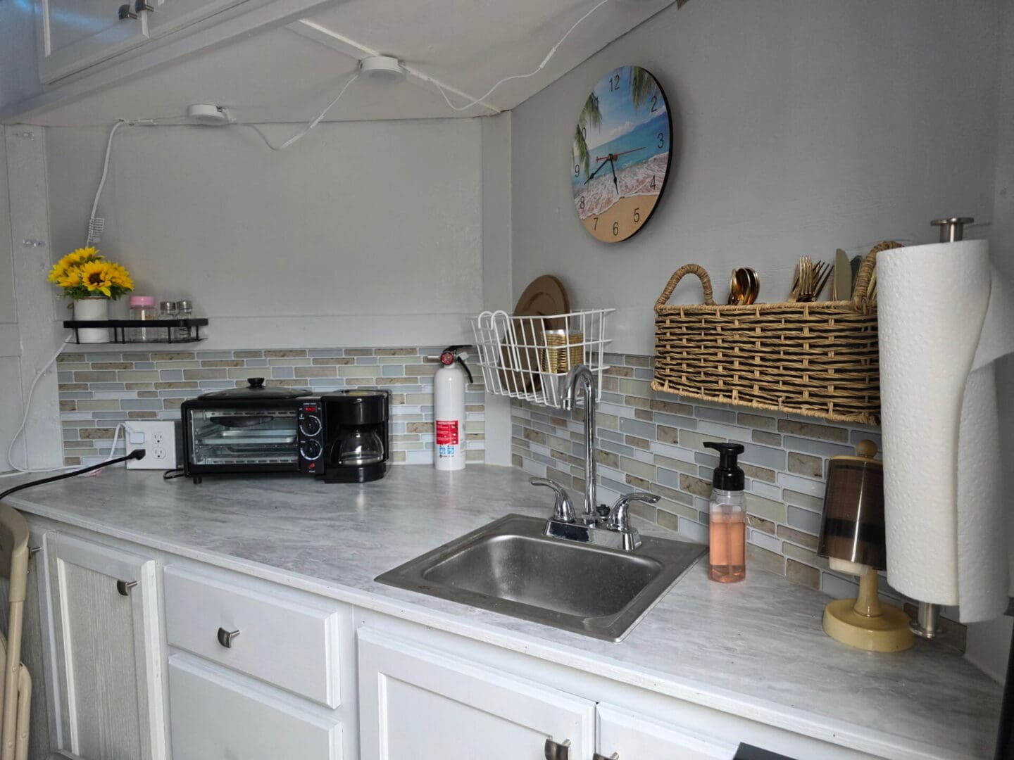 Small kitchen countertop with sink and appliances
